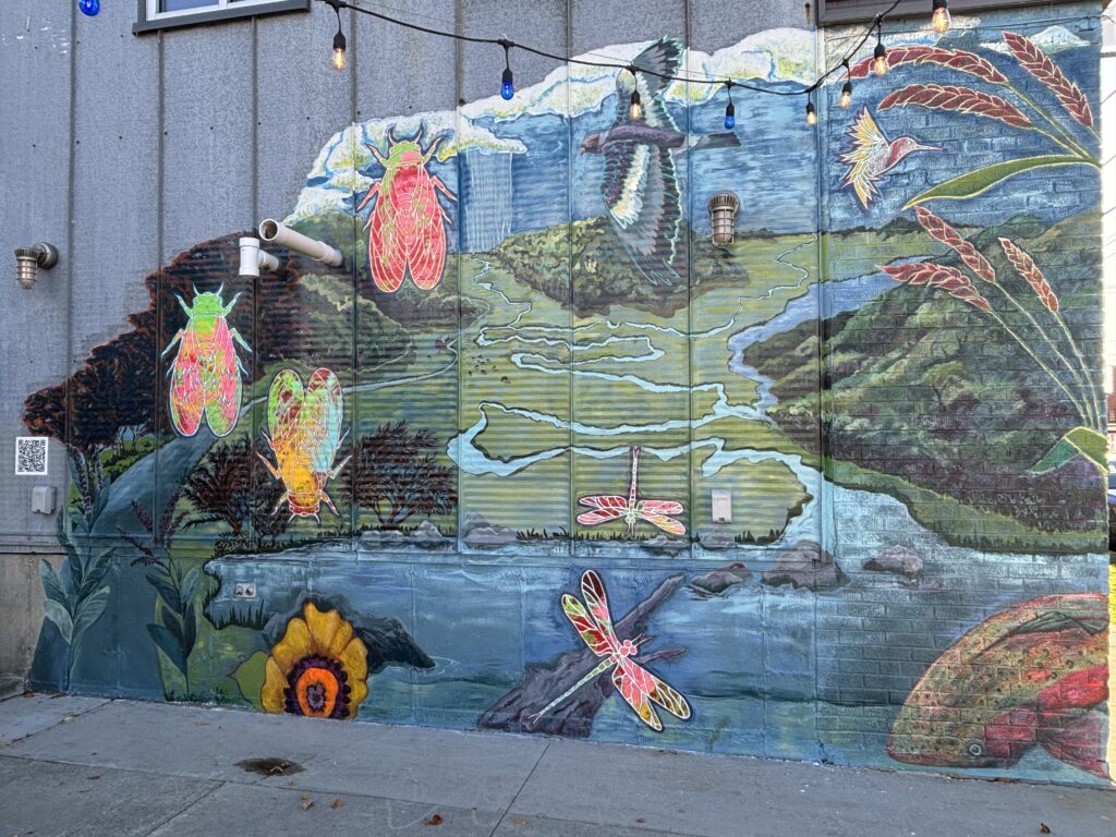 Regenerative Coexistence Mural facing the patio